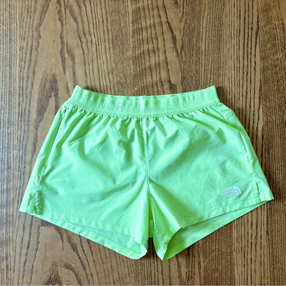North Face girls lime athletic shorts size 12
zip pocket No lining Gently worn